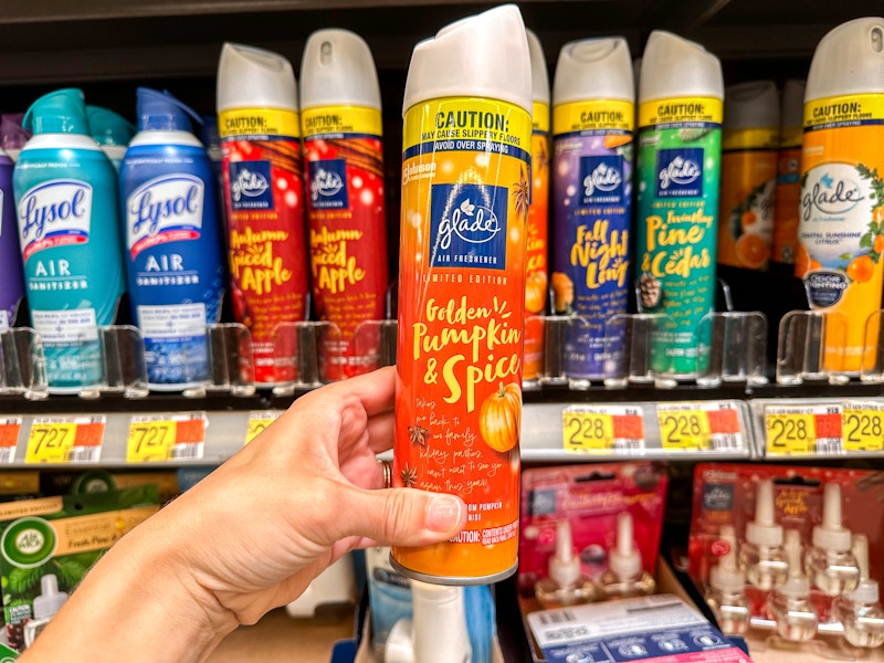 a person holding up pumpkin glad spray at walmart