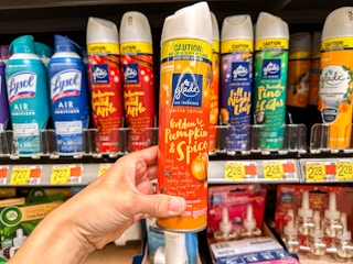 a person holding up pumpkin glad spray at walmart