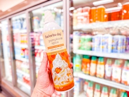 hand holding a bottle of favorite day whipped topping at target