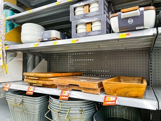 wooden cutting boards on a Walmart shelf with Rollback tags