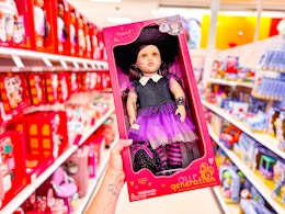 hand holding a box of the Halloween OG doll