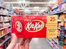 hand holding kit kat party pack at walmart