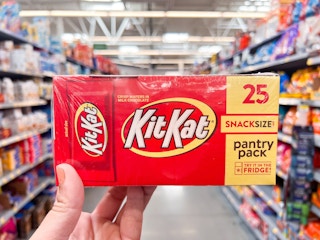 hand holding kit kat party pack at walmart