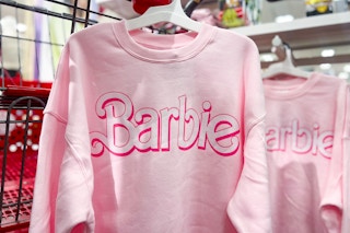 Pink Barbie Sweatshirt on hanger in front of Target shopping cart