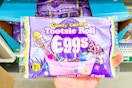 hand holding up a bag of tootsie roll eggs