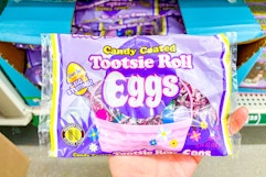 hand holding up a bag of tootsie roll eggs