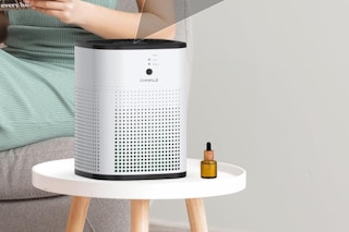 an air purifier on a small table in a room