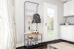 Lifestyle image of the Hastings entryway storage rack in home setting neat a window and door
