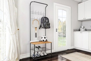 Lifestyle image of the Hastings entryway storage rack in home setting neat a window and door