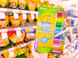 hand holding a pack of crayola 50-count markers at target
