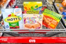 motts fruit snacks, gushers, general mills cereal bars, and nature valley granola bars in a cart