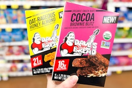 hand holding boxes of daves killer bars