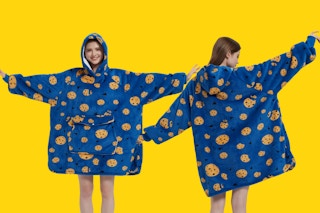 a person wearing a blue blanket hoodie with cookies on it
