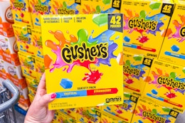 hand holding gushers fruit snacks variety pack