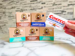 dr squatch soap on counter with hand holding costco card