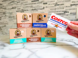 dr squatch soap on counter with hand holding costco card