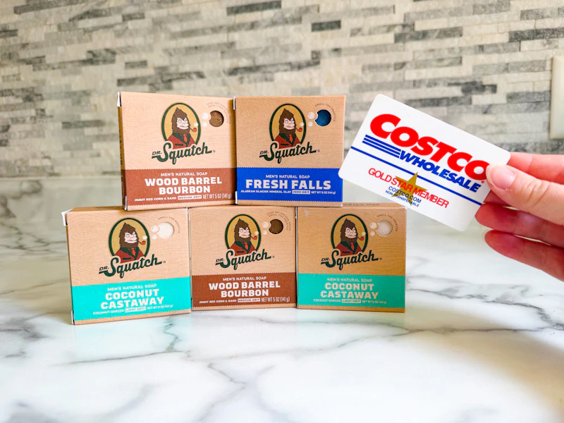 dr squatch soap on counter with hand holding costco card