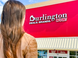 a woman walking up to a Burlington store