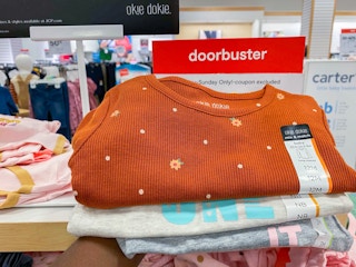 hand holding baby apparel