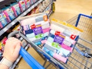 hand pushing walmart cart with two packs of hanes girls briefs underwear