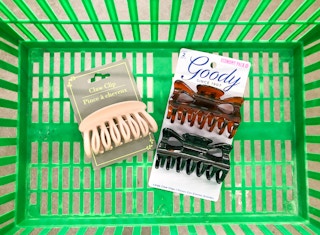 two packs of claw clips in Dollar Tree basket inside Dollar Tree