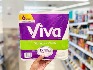 hand holding a pack of Viva Signature Paper Towels in aisle