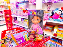 3 dora toys sitting on a target cart