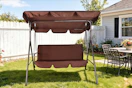 Lifestyle image of a brown 3-person patio swing outdoor in backyard setting