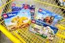 lego sets in a yellow shopping cart
