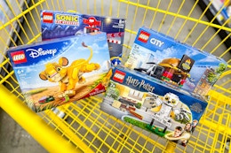 lego sets in a yellow shopping cart
