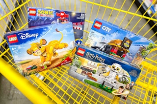 lego sets in a yellow shopping cart
