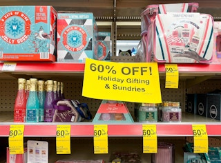 60% of Holiday Gifting and Sundries signage with various clearance items on shelf