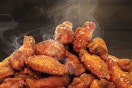a huge pile of wings from beef-o-bradys