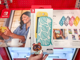 hand holding a nintendo switch lite animal crossing case at target