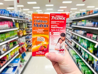 hand holding Children's Motrin/Tylenol