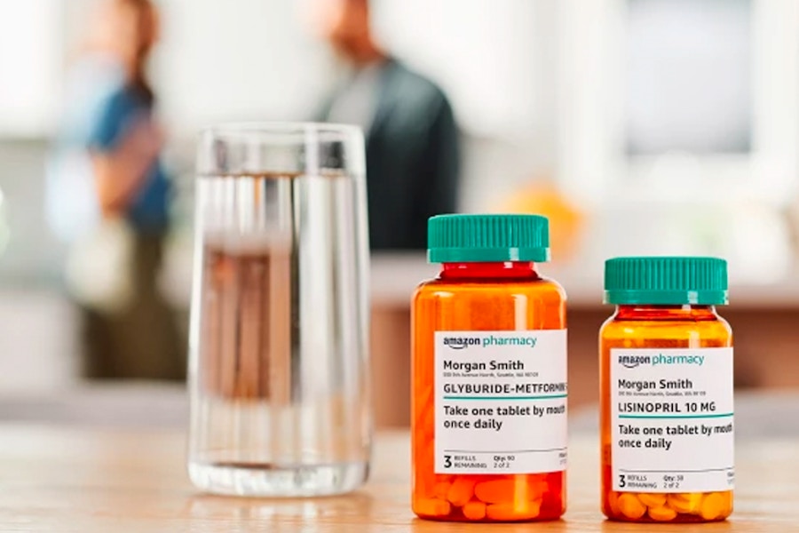 two pill bottles from amazon with a glass of water