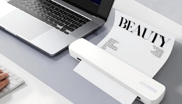 a laptop next to a wireless printer