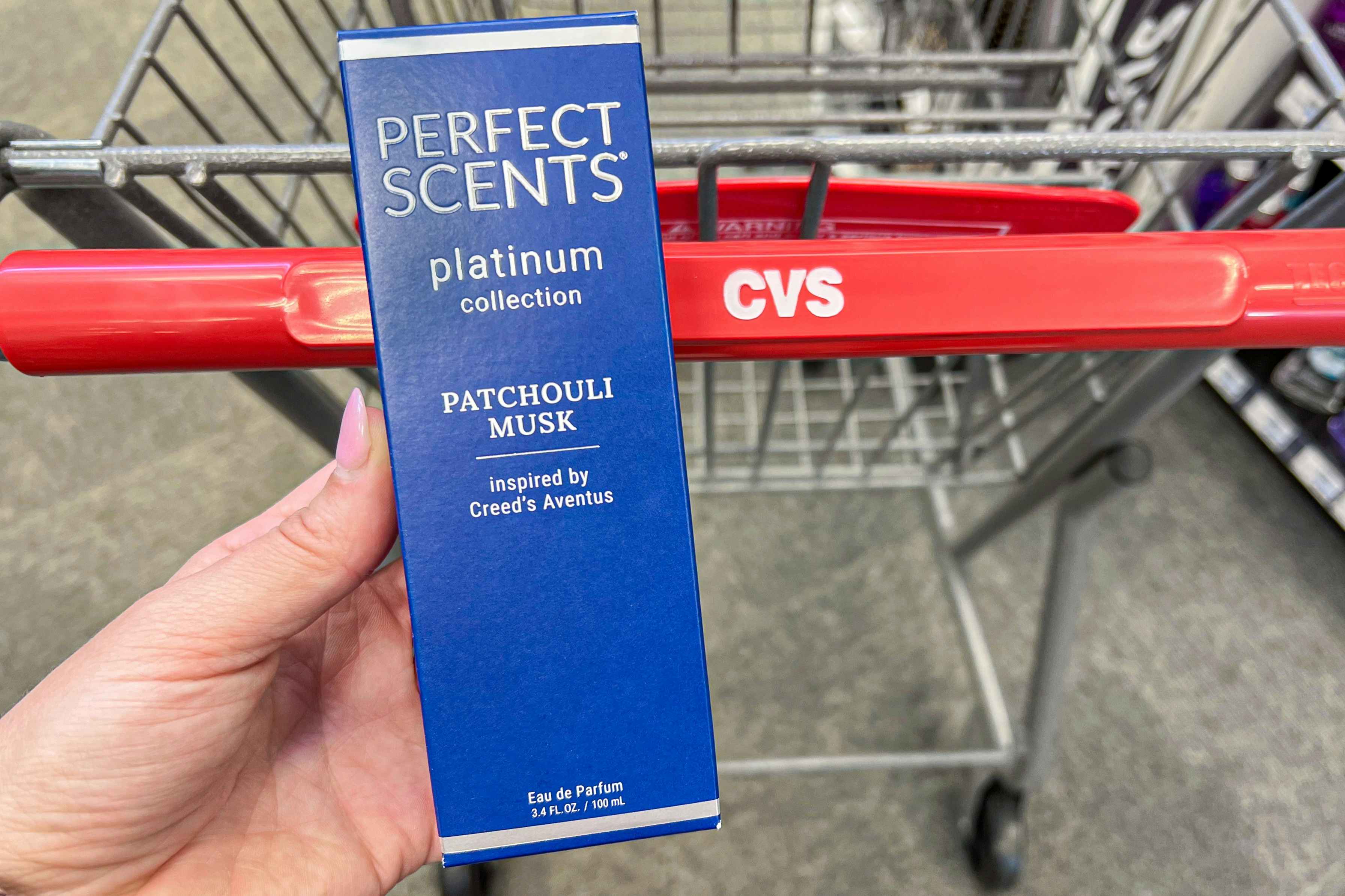 someone holding some Perfect Scents in Patchouli Musk at CVS
