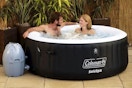 wayfair Coleman 4 Person Inflatable Hot Tub with two people sitting in the hot tub