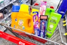arm & hammer detergent, crest and oral b oral care products, maybelline makeup, and garnier shampoo in a cart