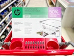 A box of hp deskjet all-in-one printer, scanner, and copier in the printers & ink aisle in Target