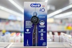 oral-b electric toothbrush on a shelf