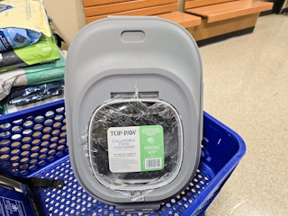 collapsible pet food storage container in a cart