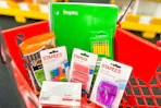 back to school supplies in a red basket