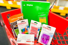 back to school supplies in a red basket