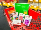 staples back to school items in a red shopping basket