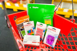 back to school supplies in a red basket