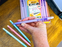 person holding mechanical pencil