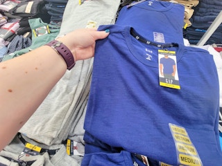 hand holding a blue mens gap tee