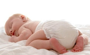a sweet baby sleeping on a blanket